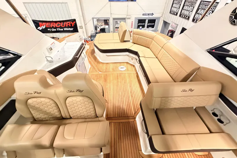 Slide: The Image of Luxurious interior of 2026 Sea Ray Sundancer 320 Coupe with elegant seating and wood flooring. - 9