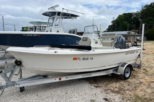 The Image of 2024 Key West 1720 Center Console boat on trailer, parked outdoors. - 0