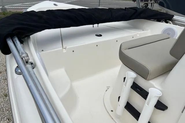 Slide: The Image of 2024 Key West 1720 Center Console boat interior with seating and rod holders. - 10