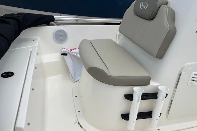 Slide: The Image of 2024 Key West 1720 Center Console boat seat with rod holders and storage. - 11