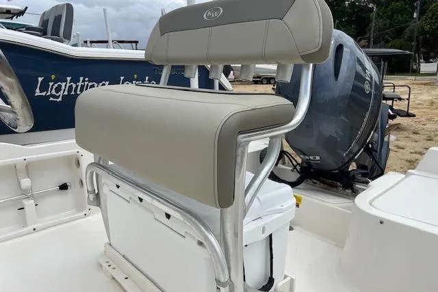 Slide: The Image of 2024 Key West 1720 Center Console boat with cushioned seating and outboard motor. - 6