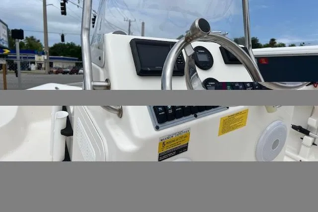 Slide: The Image of 2024 Key West 1720 Center Console boat dashboard with steering wheel and controls. - 8