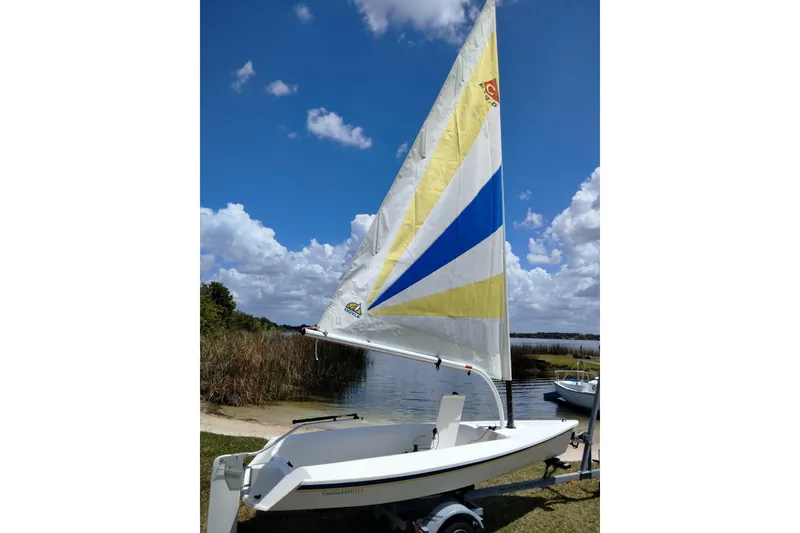 The Image of 2014 Catalina 12.5 Expo sailboat by the lakeside. - 0