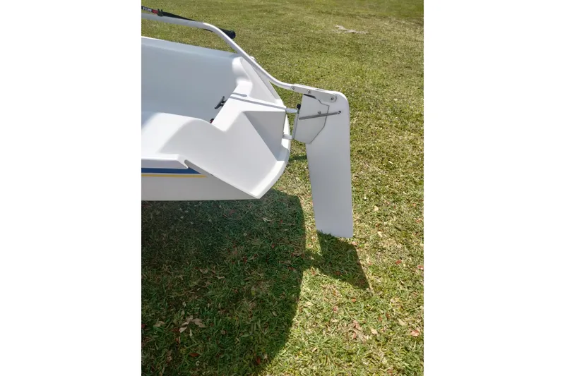 Slide: The Image of Catalina 12.5 Expo 2014 sailboat rudder on grassy surface. - 7