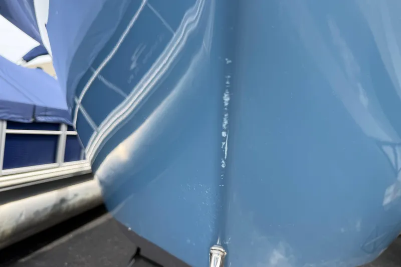 Slide: The Image of Close-up of 2024 Sea Pro 240 Dual Console boat hull in blue. - 14