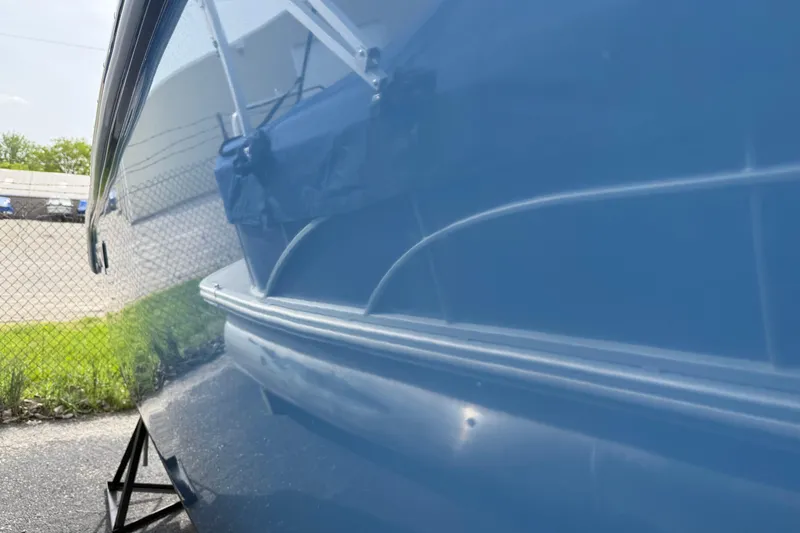 Slide: The Image of 2024 Sea Pro 240 Dual Console boat with sleek blue hull design. - 15