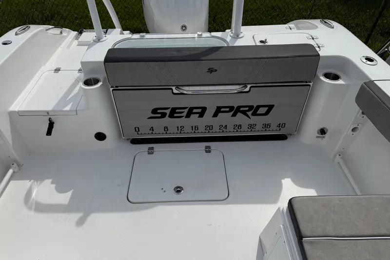Slide: The Image of 2024 Sea Pro 240 Dual Console boat interior with branded seating and measurement markings. - 19