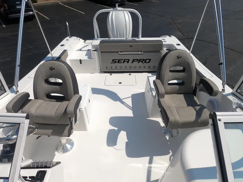 Slide: The Image of 2024 Sea Pro 240 Dual Console boat helm with Simrad electronics and comfortable seating. - 7