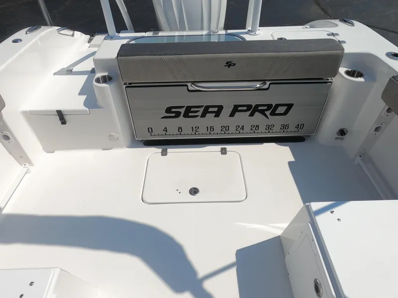 Slide: The Image of 2024 Sea Pro 240 Dual Console boat interior with two cushioned seats. - 8