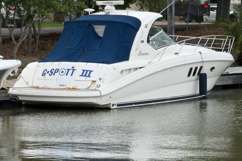 The Image of A 2008 Sea Ray 380 Sundancer yacht docked with a blue cover. - 0