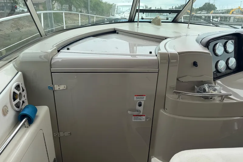Slide: The Image of Interior view of 2008 Sea Ray 380 Sundancer yacht featuring a compact sink and storage cabinets. - 11