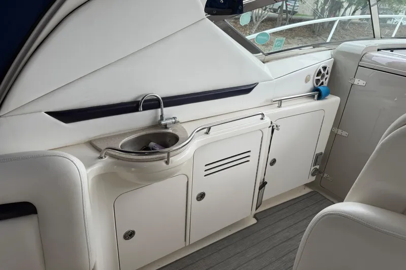 Slide: The Image of Interior of 2008 Sea Ray 380 Sundancer yacht with seating and kitchenette. - 12