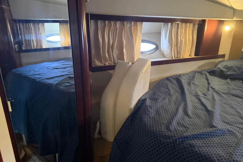 Slide: The Image of Luxurious cabin interior of 2008 Sea Ray 380 Sundancer with cozy bedding. - 29