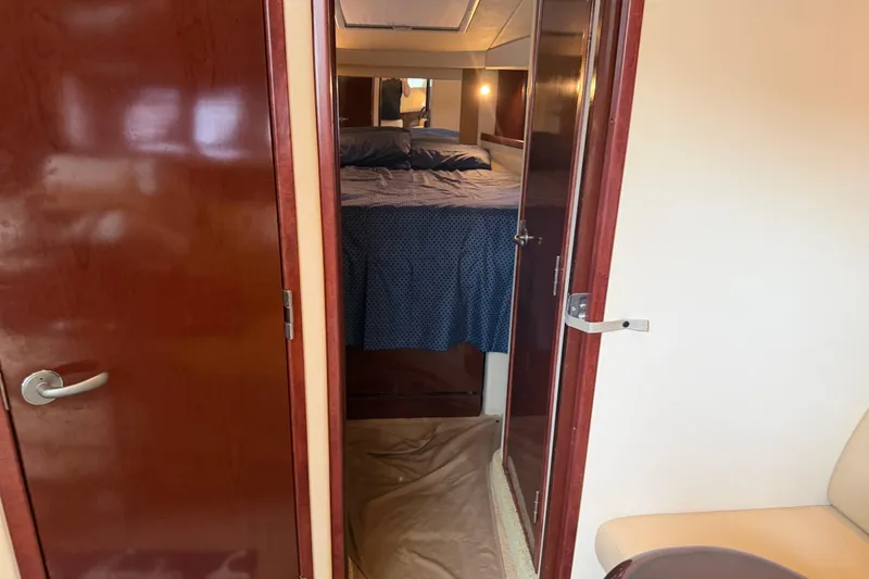 Slide: The Image of 2008 Sea Ray 380 Sundancer bathroom with sink, toilet, and porthole window. - 31