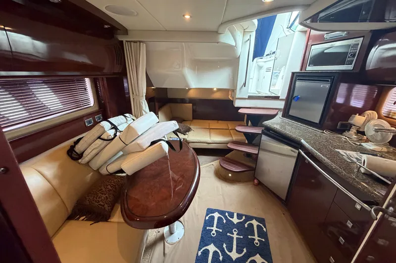 Slide: The Image of Engine compartment of a 2008 Sea Ray 380 Sundancer with fire extinguisher and control panel. - 37