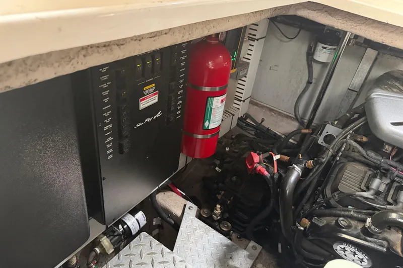 Slide: The Image of Engine compartment of a 2008 Sea Ray 380 Sundancer with Mercury components visible. - 38