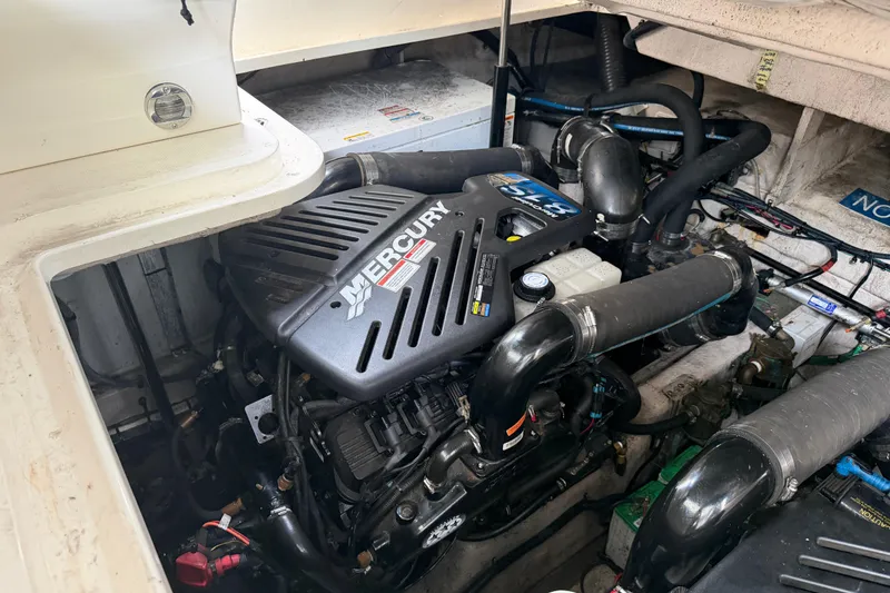 Slide: The Image of Engine compartment of a 2008 Sea Ray 380 Sundancer with visible batteries and wiring. - 40