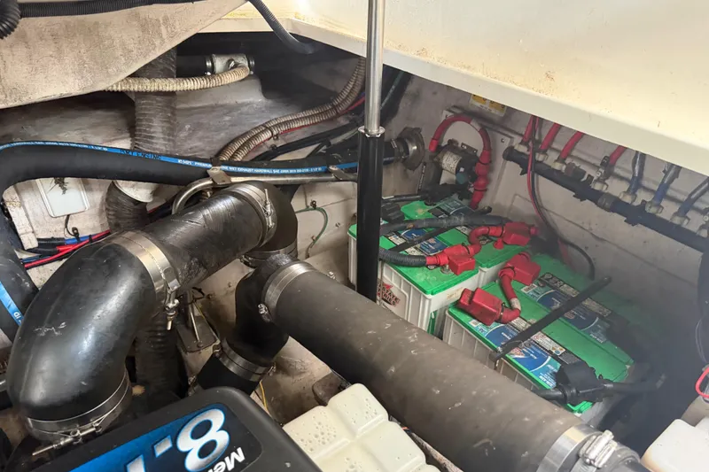 Slide: The Image of Engine compartment of 2008 Sea Ray 380 Sundancer with visible hoses and wiring. - 41