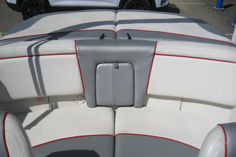 Slide: The Image of Interior seating of a 2008 Sea Ray 195 Sport boat with red accents. - 10