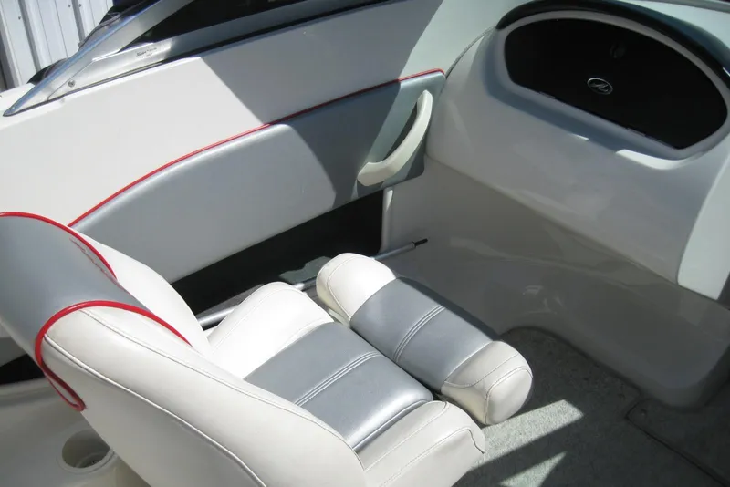 Slide: The Image of Interior of a 2008 Sea Ray 195 Sport boat, featuring white and gray seating. - 11
