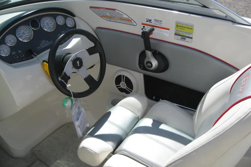 Slide: The Image of 2008 Sea Ray 195 Sport boat interior with steering wheel and control panel. - 12