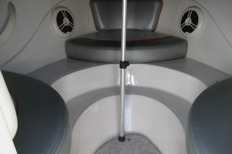 Slide: The Image of Interior seating of 2008 Sea Ray 195 Sport boat with gray cushions and speakers. - 16