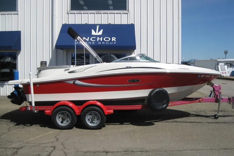 Slide: The Image of 2008 Sea Ray 195 Sport boat on trailer outside Anchor Marine Group building. - 3