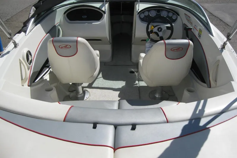 Slide: The Image of 2008 Sea Ray 195 Sport boat interior with white seating and red accents. - 9
