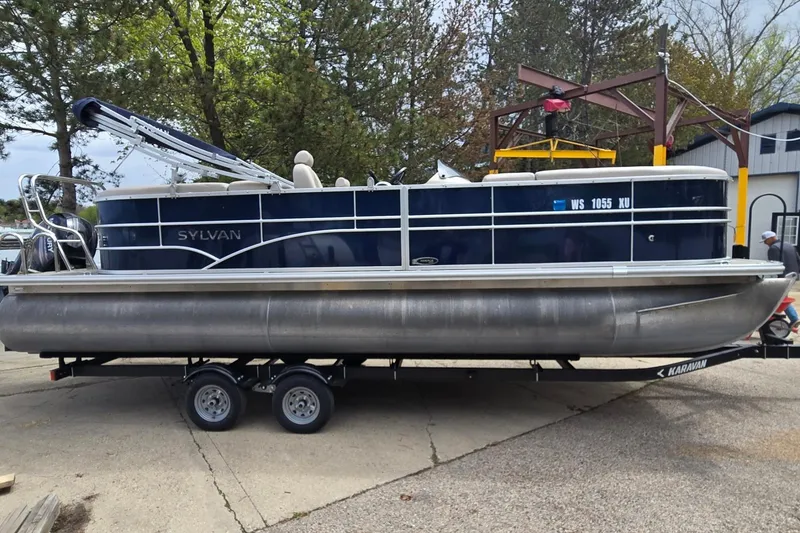 The Image of 2016 Sylvan Mirage Cruise 8522 LZ pontoon boat on trailer, parked outdoors. - 0