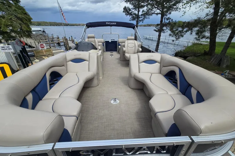 Slide: The Image of 2016 Sylvan Mirage Cruise 8522 LZ pontoon boat with spacious seating on a scenic lake. - 11