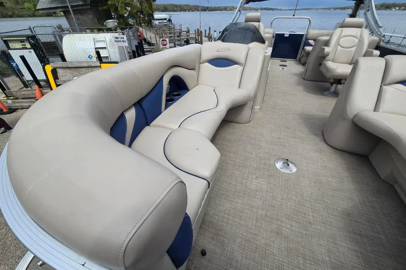 Slide: The Image of 2016 Sylvan Mirage Cruise 8522 LZ pontoon boat with spacious seating and lake view. - 14