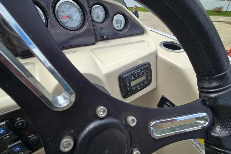 Slide: The Image of Steering wheel and dashboard of 2016 Sylvan Mirage Cruise 8522 LZ boat. - 15
