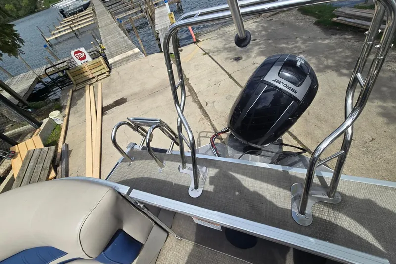 Slide: The Image of 2016 Sylvan Mirage Cruise 8522 LZ pontoon boat with Mercury outboard motor at dock. - 22