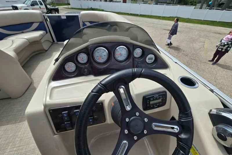 Slide: The Image of 2016 Sylvan Mirage Cruise 8522 LZ dashboard with steering wheel and gauges. - 23