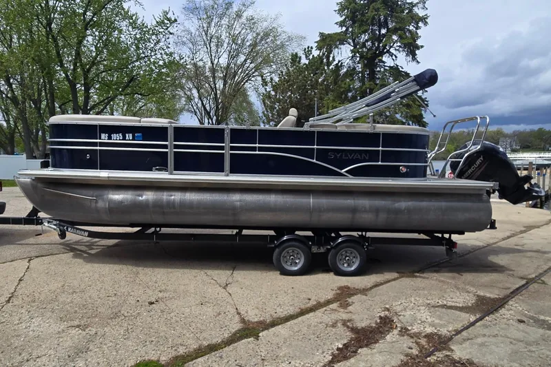 Slide: The Image of 2016 Sylvan Mirage Cruise 8522 LZ pontoon boat on trailer, parked outdoors. - 7
