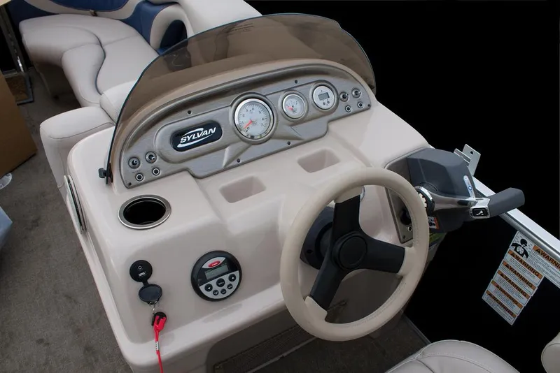 Slide: The Image of Manufacturer Provided Image: 2016 Sylvan Mirage Cruise 8522 LZ boat dashboard with steering wheel and controls. - 8