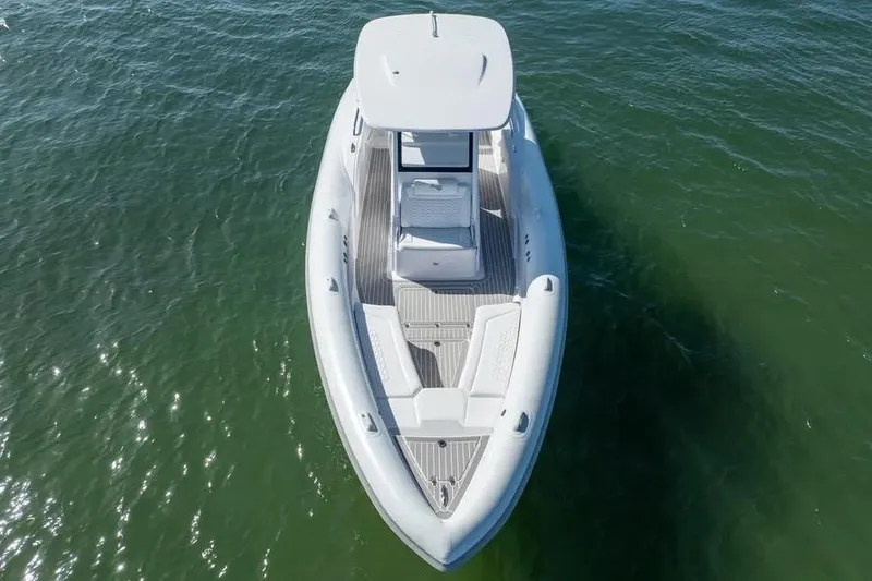 Slide: The Image of Aerial view of 2025 Airship 340 boat on calm green water. - 4