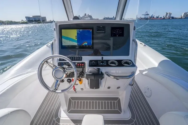 Slide: The Image of Cockpit of 2025 Airship 340 boat with steering wheel and navigation display. - 7