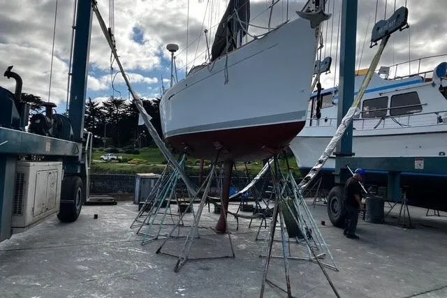 Slide: The Image of Beneteau First 36.7 sailboat from 2002 on dry dock for maintenance. - 17
