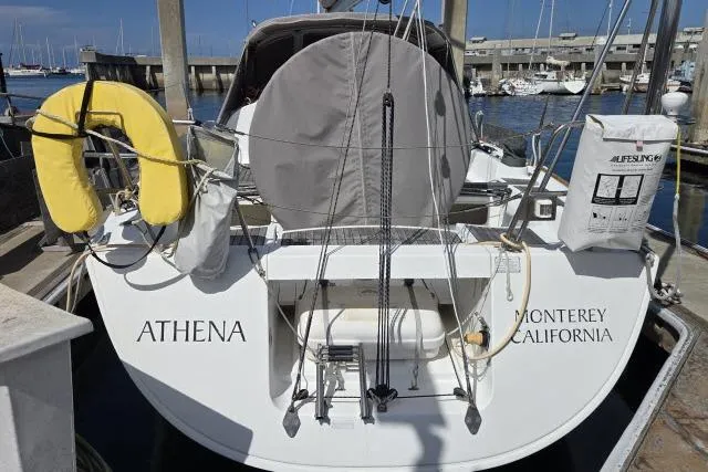 Slide: The Image of Beneteau First 36.7 sailboat docked, named "Athena," Monterey, California, 2002 model. - 4