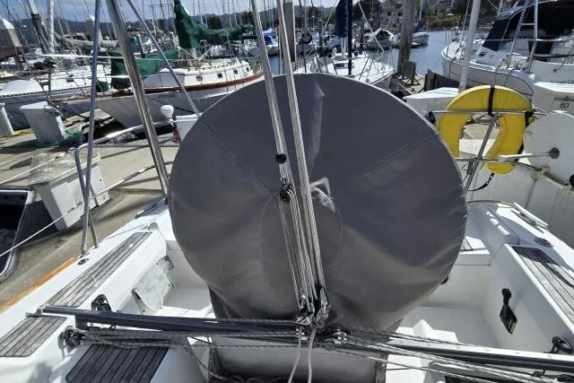 Slide: The Image of Beneteau First 36.7 sailboat cockpit with covered wheel, docked in marina, 2002 model. - 6