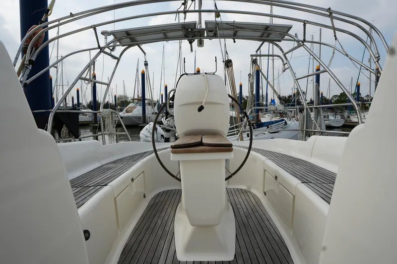 Slide: The Image of Cockpit view of a 2007 Bavaria 37 C sailboat in a marina. - 13