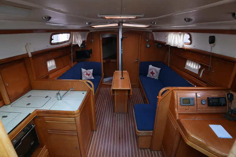 Slide: The Image of Interior of 2007 Bavaria 37 C yacht with wooden finish and blue seating. - 14