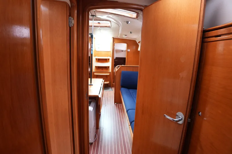 Slide: The Image of Interior of 2007 Bavaria 37 C yacht with wooden finish and blue seating. - 16