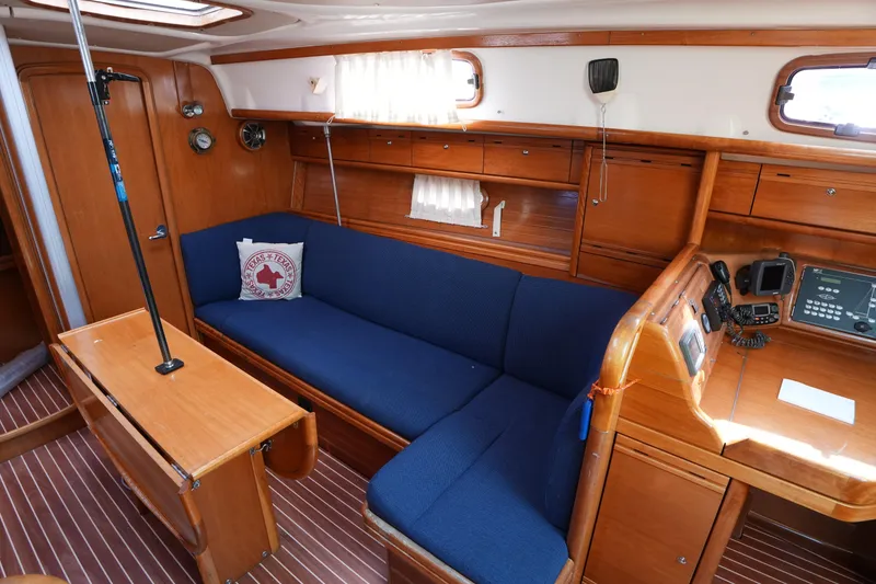 Slide: The Image of Interior of 2007 Bavaria 37 C yacht with blue seating and wooden cabinetry. - 20