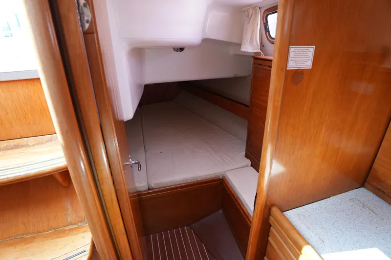 Slide: The Image of Cozy cabin interior of 2007 Bavaria 37 C sailboat with wooden finishes. - 27