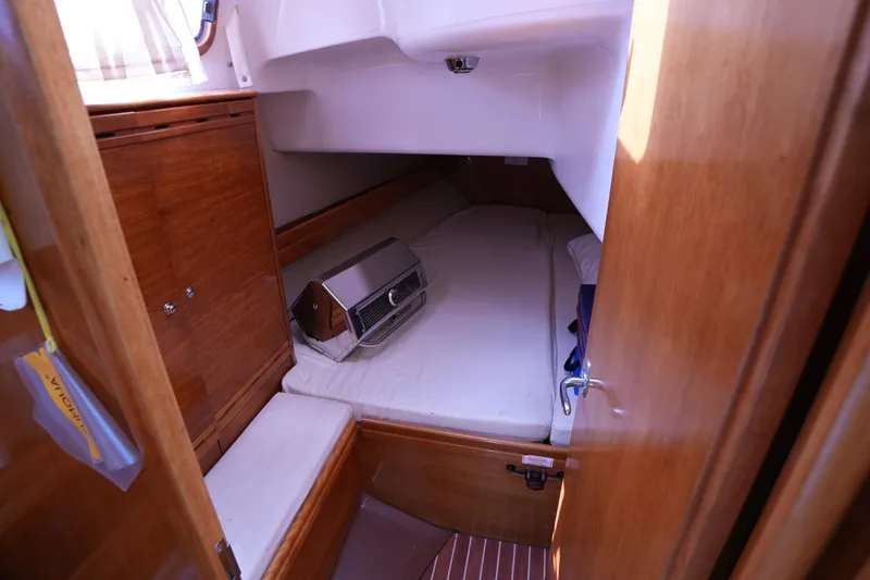 Slide: The Image of Cozy cabin interior of 2007 Bavaria 37 C yacht with wooden furnishings. - 28