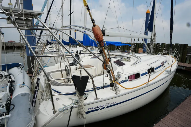 Slide: The Image of 2007 Bavaria 37 C sailboat docked at marina, featuring sleek design and spacious deck. - 3