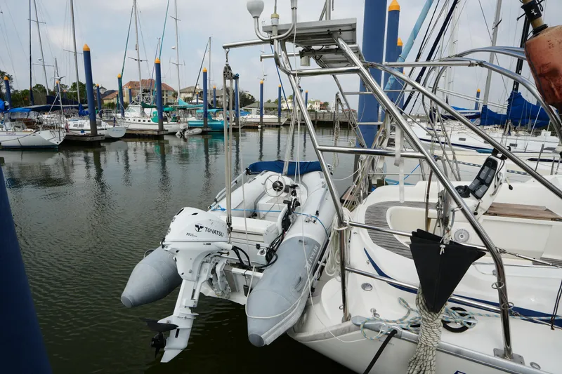 Slide: The Image of Sailboat Bavaria 37 C (2007) docked with dinghy and outboard motor in marina. - 4