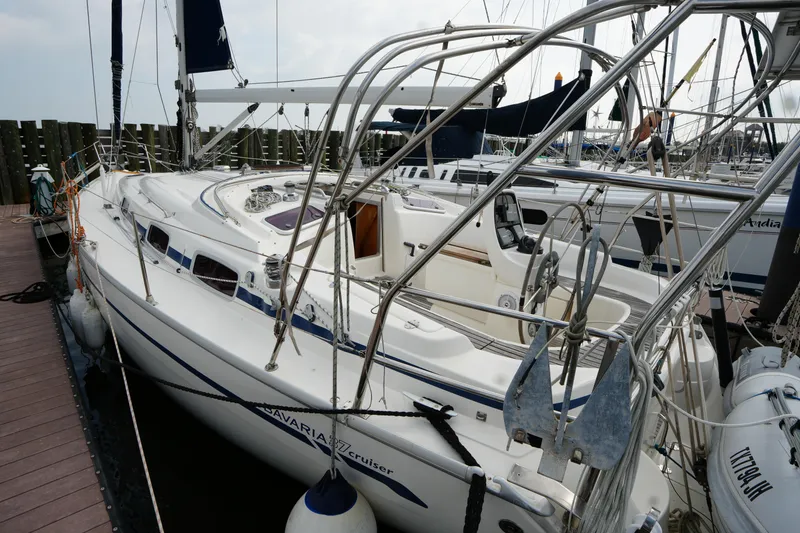 Slide: The Image of Sailboat Bavaria 37 C, 2007 model, docked at marina with visible deck and rigging. - 5